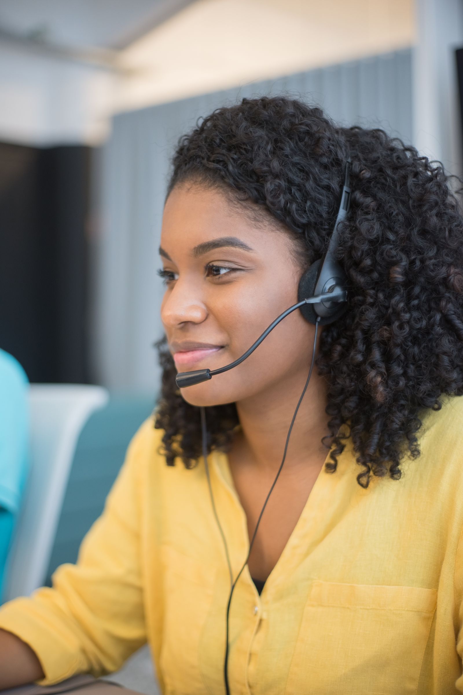 Support agent wearing headphones