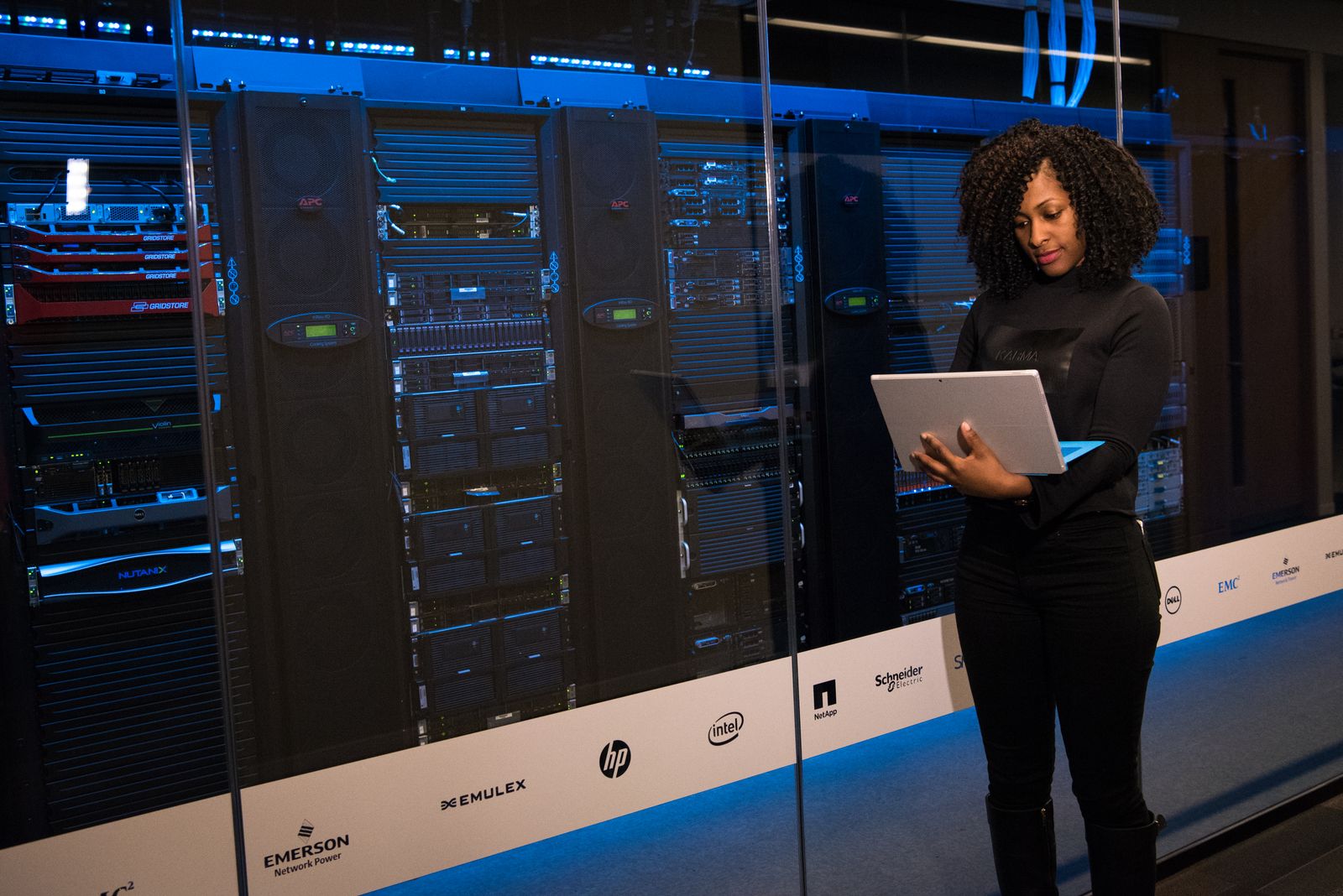 VET1 engineer beside server racks